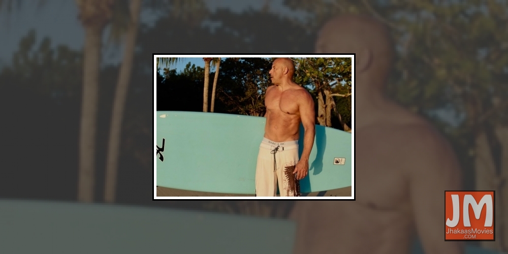 Hollywood superstar Vin Diesel has left  his fans go weak in the knees as he he poses shirtless in a pair of board shorts on the beach.