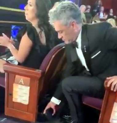 Video of Taika Waititi hiding his Oscar trophy under a seat goes viral.