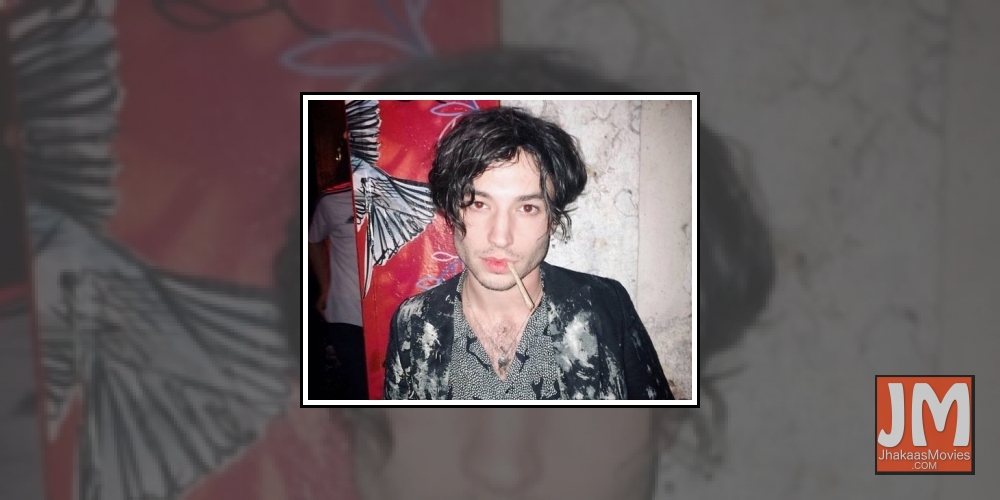 Ezra Miller appears to throttle, shove female fan in video.