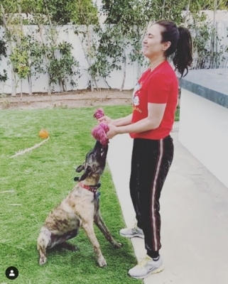 Preity Zinta workout with pet dog.
