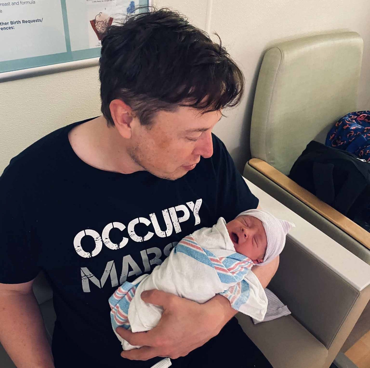 Elon Musk shares photos of newborn son.
