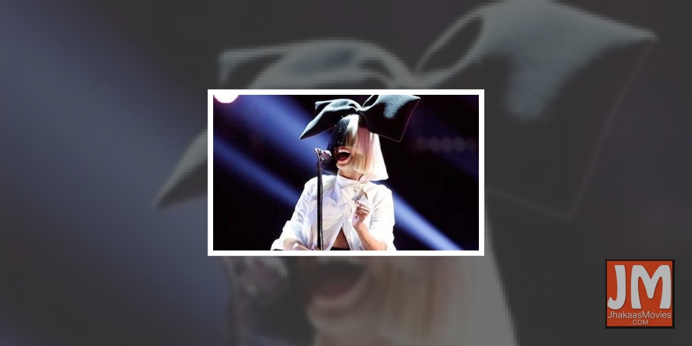 Sia reveals she adopted two 18-yr-old boys last year.