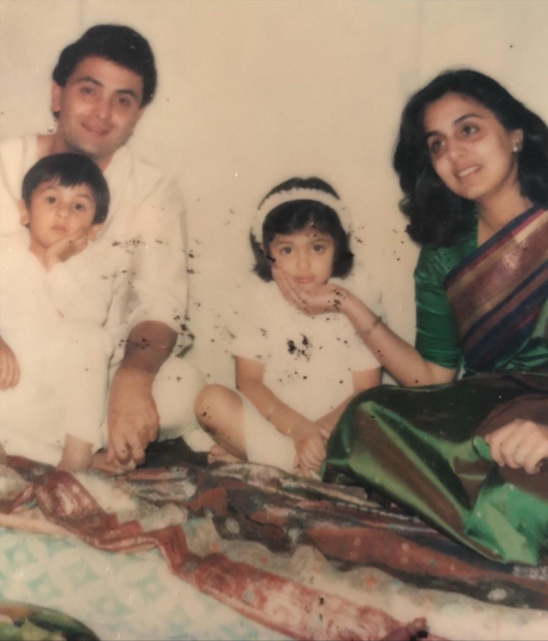 Throwback Thursday: Cute little Ranbir sits in Rishi Kapoor's lap.