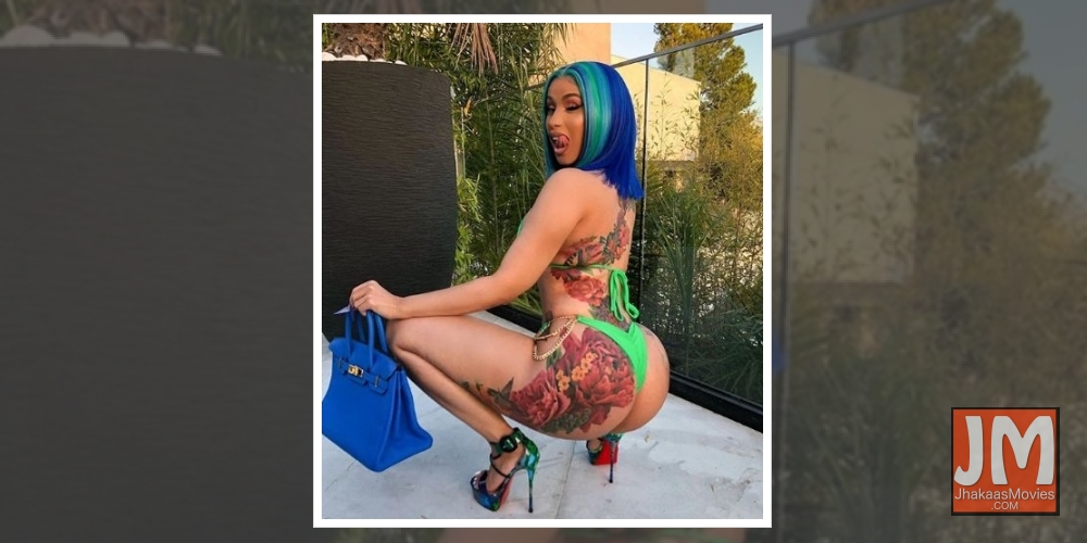 Cardi B flaunts massive colourful back tattoo.