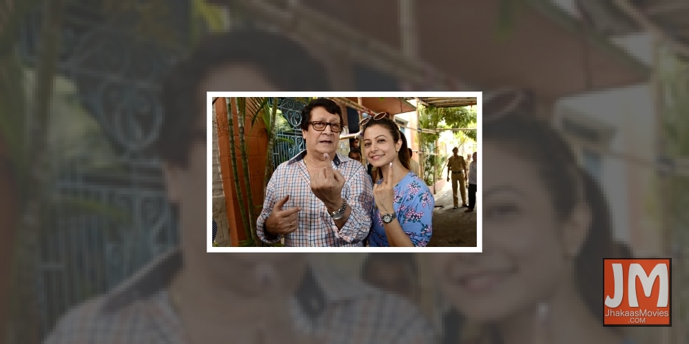 Kolkata: Actor Ranjit Mallick with his daughter-actress Koel Mallick, show their forefinger marked with indelible ink after casting vote during the last phase of 2019 Lok Sabha polls, in Kolkata, on May 19, 2019.