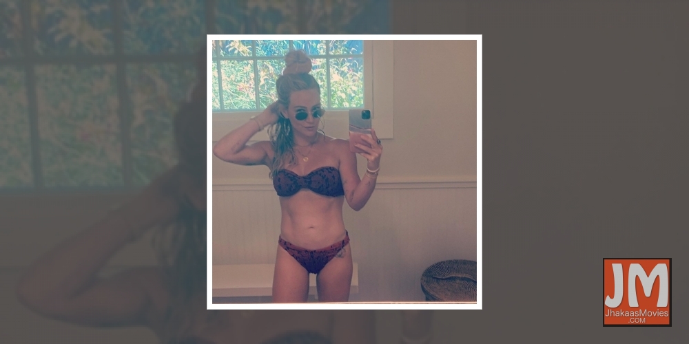 Hilary Duff flaunts toned abs.