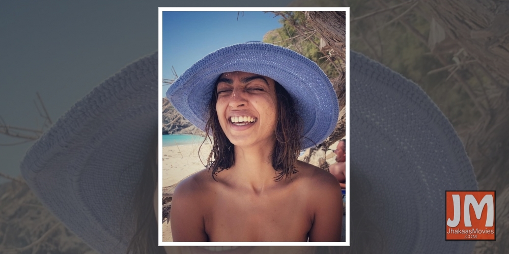 Radhika Apte shares a 'happy' picture in 'birth suit' from beach.