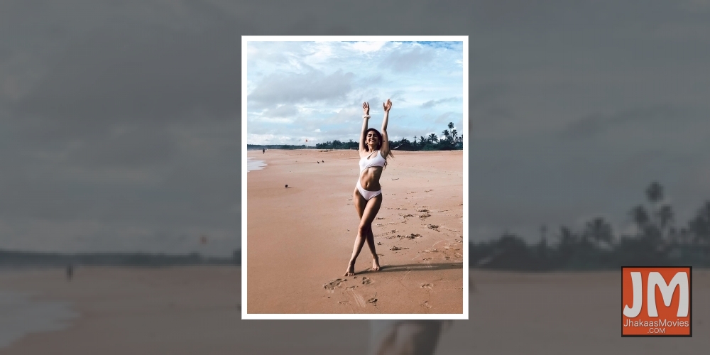 Alaya F celebrates 'freedom' in a white cut-out monokini.