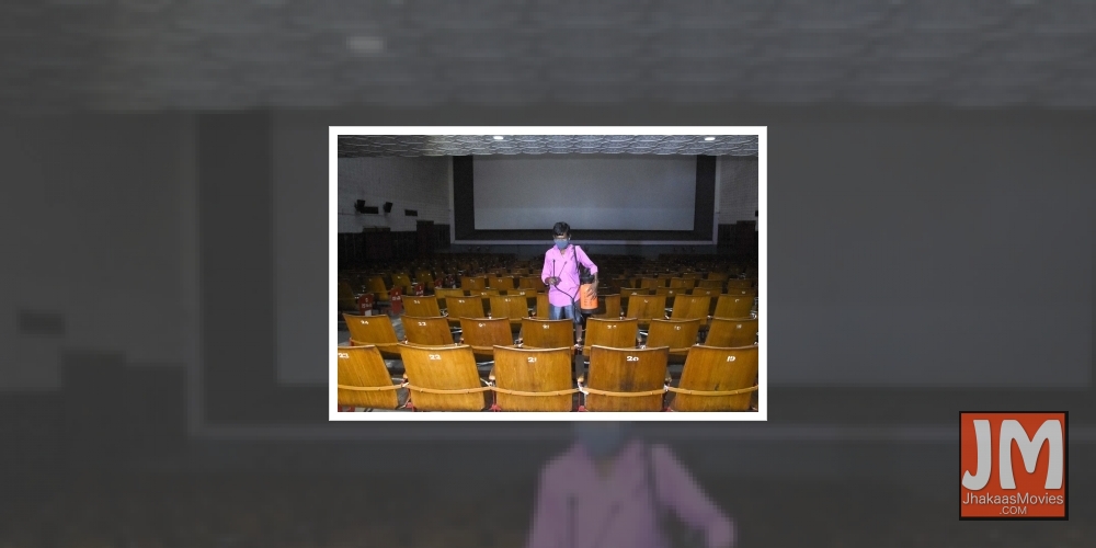 Bengaluru:  A worker sanitises a cinema hall ahead of its reopening as part of Unlock 5.0 amid measures against COVID-19, in Bengaluru on Oct 15, 2020.