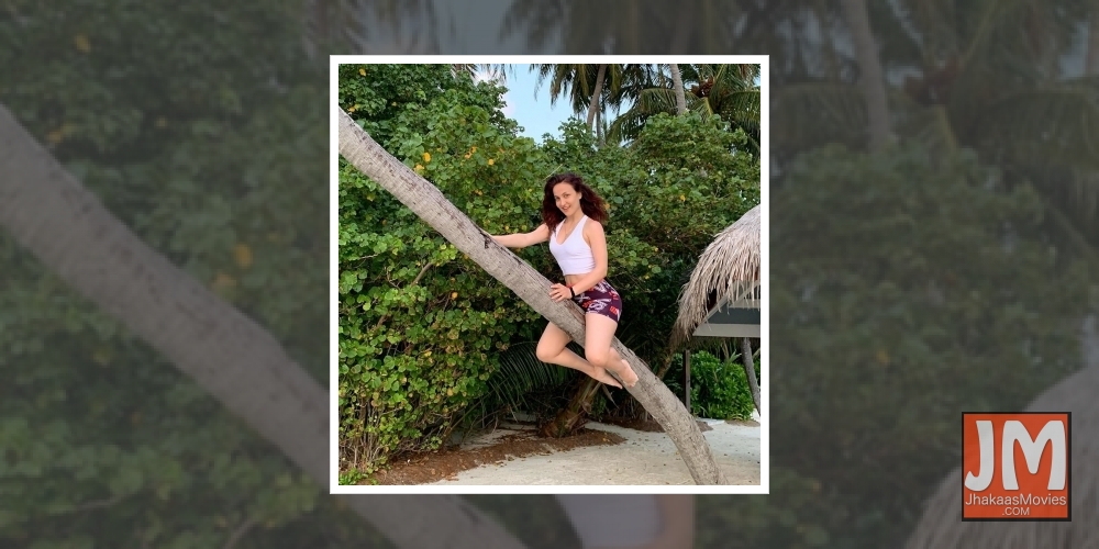 Elli AvrRam turns a flying witch riding the stick on Halloween.