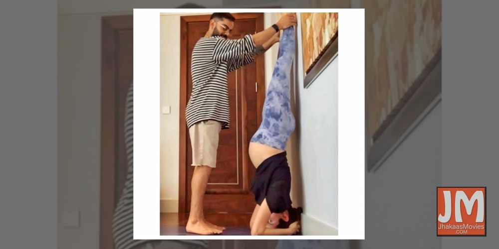 Pregnant Anushka Sharma performs Shirshasana with Virat's support.