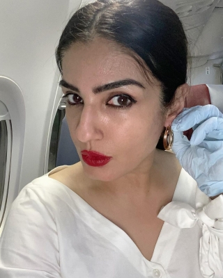 Actress Raveena Tandon has shared a picture doing her final checks before jetting off. The picture is among a string of images she has posted on Instagram that capture her various moods from fixing earrings to taking mirror selfies.