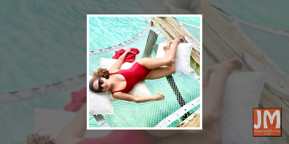 Salma Hayek looks fiery hot in monokini post.