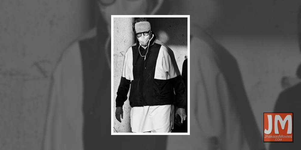 Amitabh Bachchan wearing a mask