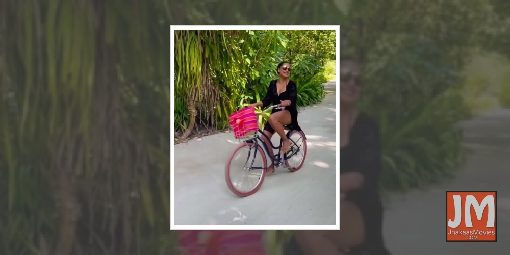 Bollywood actress Bipasha Basu says she loves cycling. The actress has posted a video that sees her cycling in Maldives. In the Instagram clip, she rides her wheels in a black bikini paired with a hot pink bottom and a black cover up