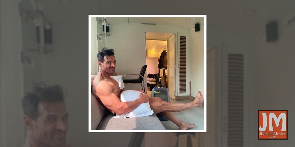 Actor John Abraham treated his fans to an interesting picture of himself on Instagram on Tuesday. Posing with just a pillow, the actor wrote about how he was waiting for his clothes to arrive!