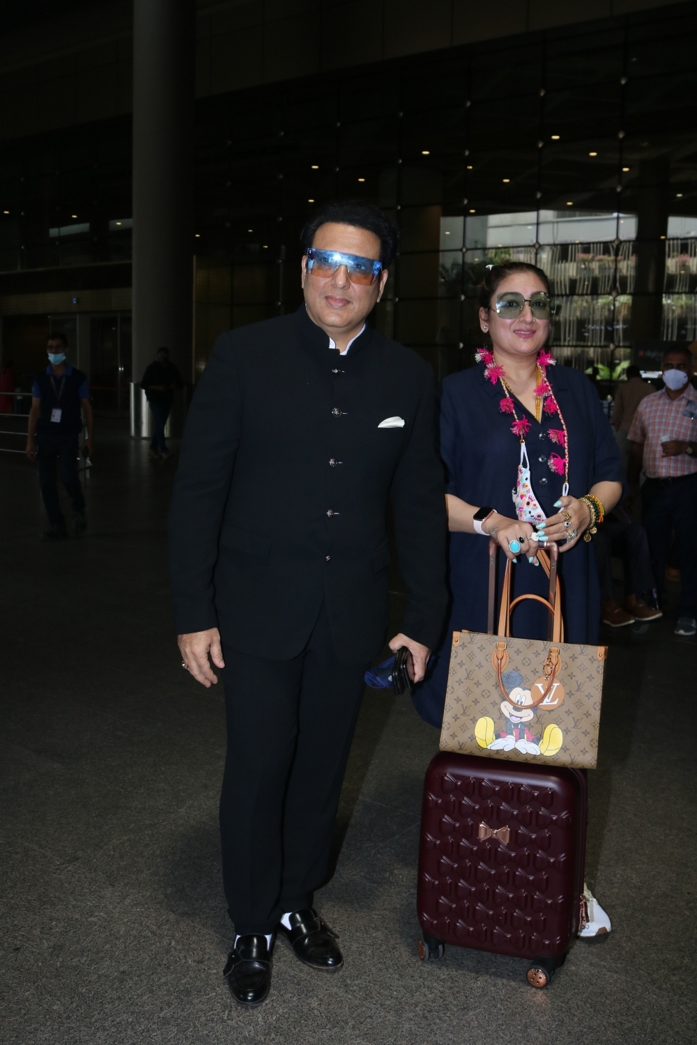 Mumbai: Govinda & Wife Sunita Ahuja Spotted at Airport On Monday 22 March, 2021. (Photo: IANS)