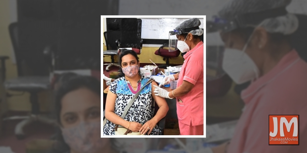 Health workers administering the COVID-19 vaccine to people during COVID-19 vaccination drive at KC General Hospital and some people waiting during COVID-19 vaccination drive in Bengaluru on Sunday 23 May 2021.