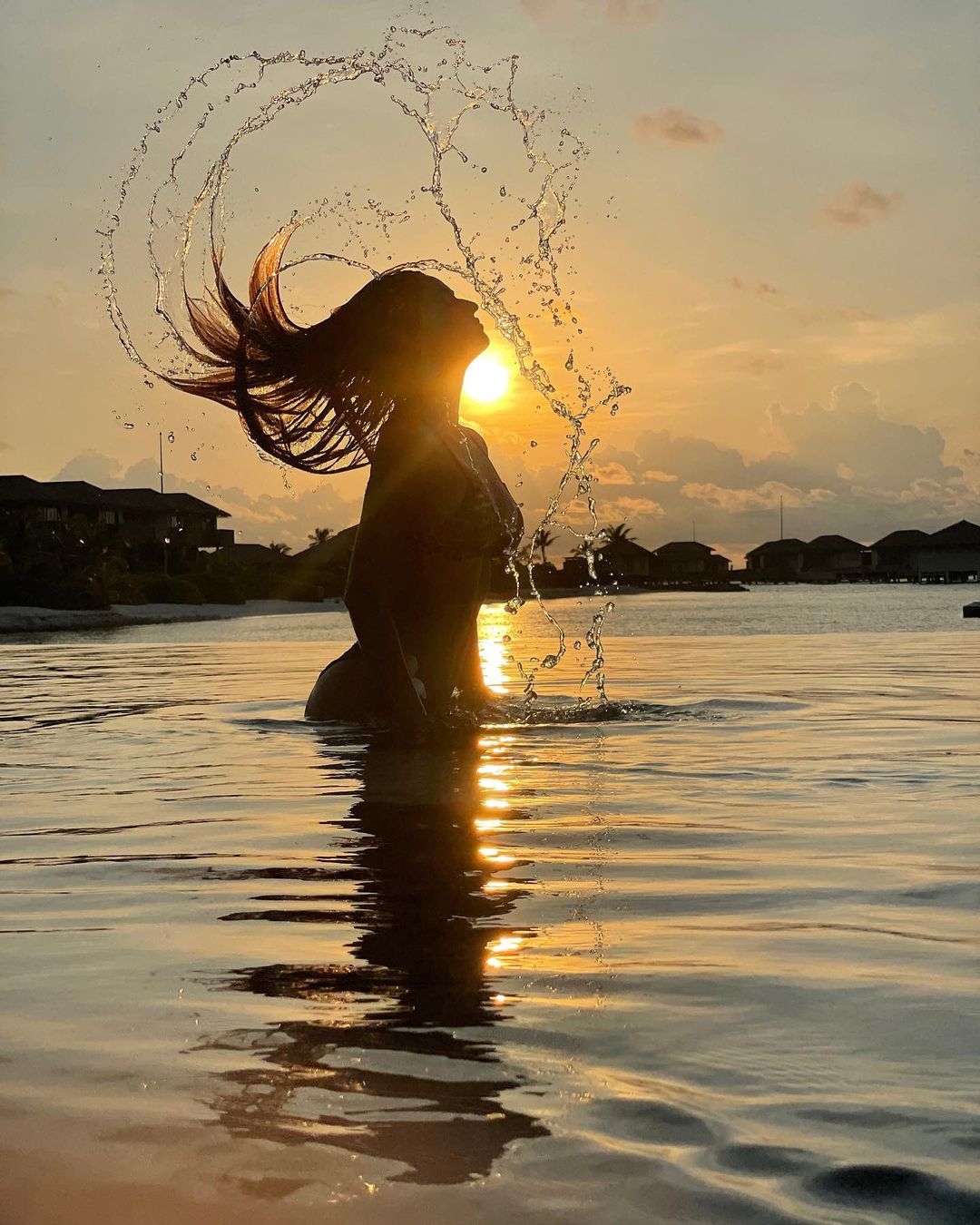 Disha Patani's new picture is about a mellow sun and sultry splash.(photo:Instagram)