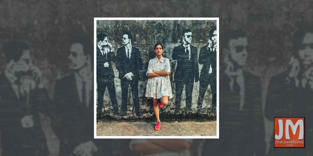 Kubbra Sait shares a cool picture against a wall mural