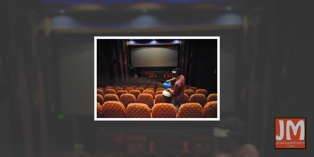 New Delhi: Workers sanitized cinema hall after the reopen from Monday for 50% by Delhi Government at Delight picture hall Daryaganj in New Delhi on Sunday July 25, 2021.