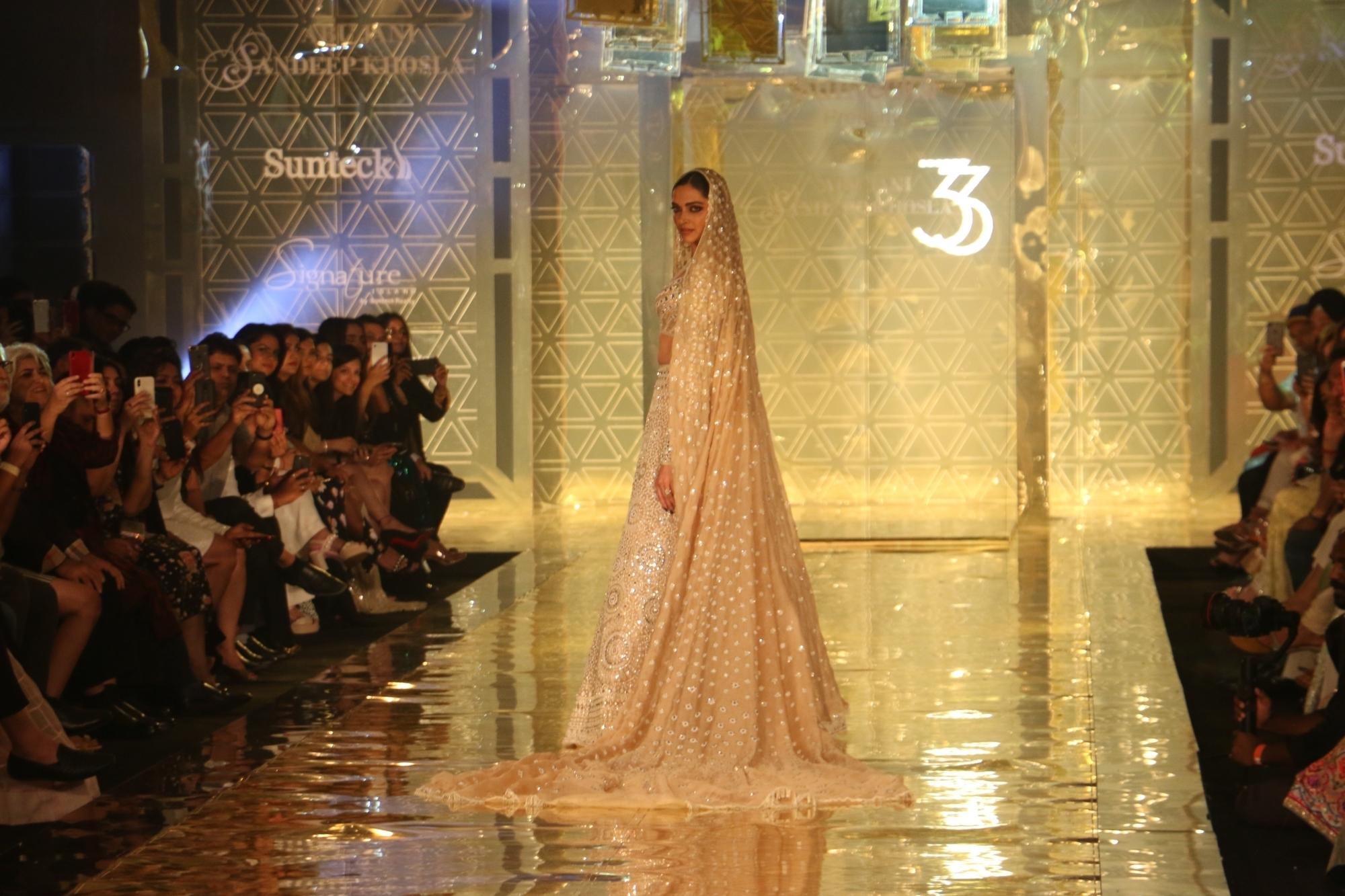 Mumbai: Actress Deepika Padukone showcases a creation of fashion designer Abu Jani-Sandeep Khosla during a fashion show in Mumbai, on Sep 5, 2019. (Photo: IANS)