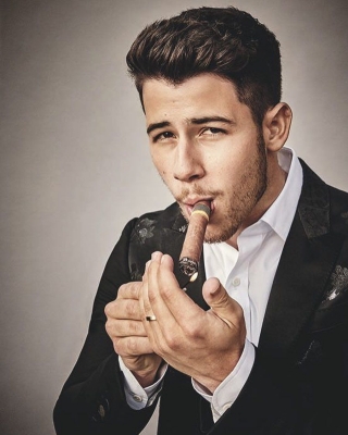 Singer Nick Jonas is thrilled about being the first person under 30 to hold a cigar and feature on the cover of Cigar Aficionado magazine. Like most of his fans, his wife and actress Priyanka Chopra went on gushing about the 
