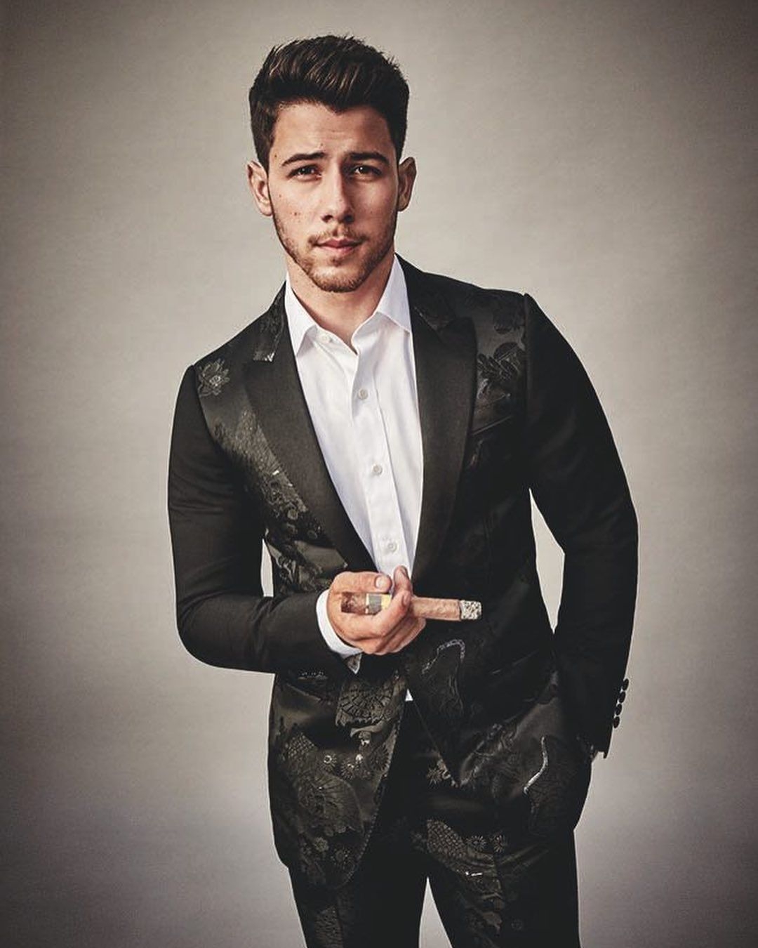 Singer Nick Jonas is thrilled about being the first person under 30 to hold a cigar and feature on the cover of Cigar Aficionado magazine. Like most of his fans, his wife and actress Priyanka Chopra went on gushing about the "yummy" singer.