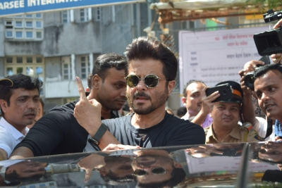 Mumbai: Actor Anil Kapoor shows his inked finger after casting his vote for Maharashtra Assembly elections, in Mumbai on Oct 21, 2019. (Photo: IANS)