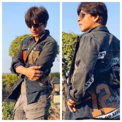 Superstar Shah Rukh Khan is inspired by the fashion sense of his close friend and filmmaker Karan Johar, and says he is trying to match up to it.