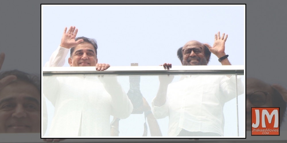 Chennai: Actors Kamal Hassan and Rajinikanth wave at fans during the inauguration of the statue of late film director K. Balachandar at the new office premises of Raaj Kamal Films International, in Chennai on Nov 8, 2019.