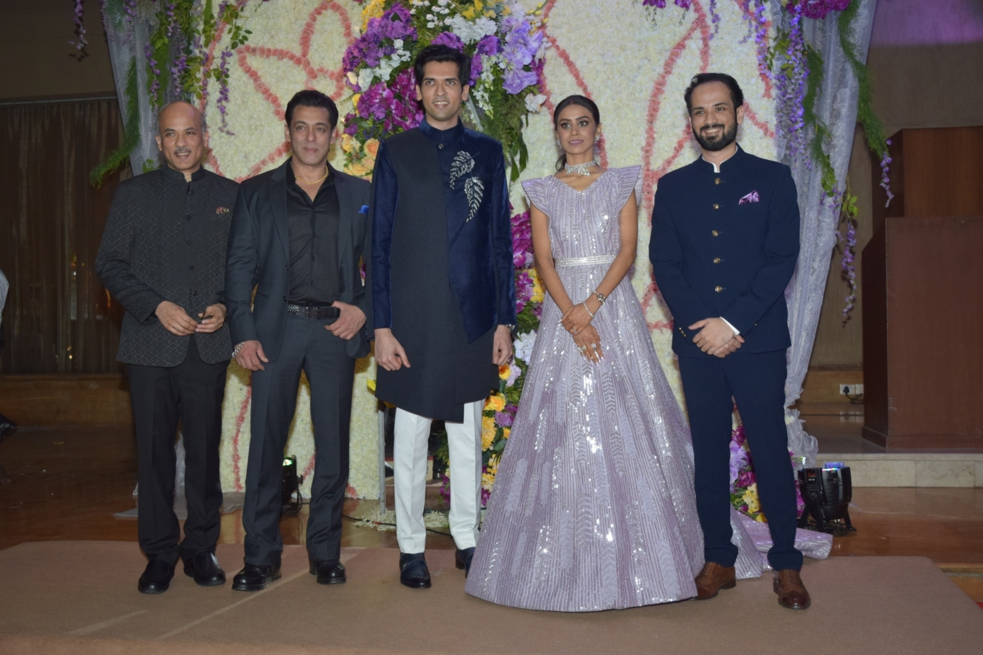 Mumbai: Filmmaker Sooraj Barjatya and actors Salman Khan and Madhuri Dixit with the newly weds Devaansh Barjatya (Sooraj Barjatya's son) and Nandini (Barjatya's daughter-in-law) at their wedding reception in Mumbai on Nov 29, 2019. (Photo: IANS)