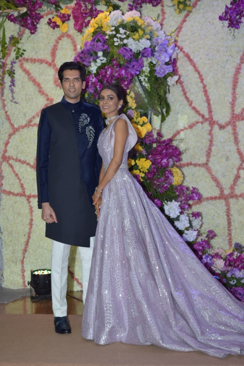 Mumbai: Filmmaker Sooraj Barjatya's son Devaansh Barjatya and his wife Nandini at their wedding reception in Mumbai on Nov 29, 2019. (Photo: IANS)