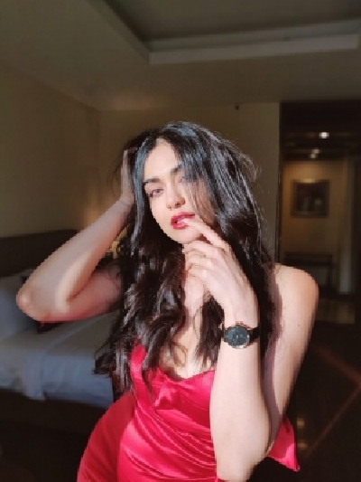 Bollywood actress Adah Sharma looked hot in a stunning red off shoulder gown. Adah looked stunning in a bright red off shoulder gown with a thigh high slit.