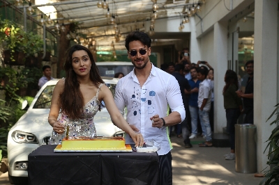 Mumbai: Actress Shraddha Kapoor accompanied by her "Baaghi 3" co-star Tiger Shroff, cuts her birthday cake during the promotions of their upcoming film in Mumbai on March 3, 2020. (Photo: IANS)