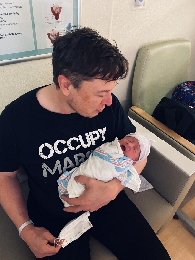 Elon Musk shares photos of newborn son.