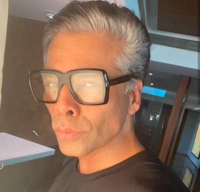 Photos for Karan Johar on self-isolation after two household staff test COVID-19 positive.