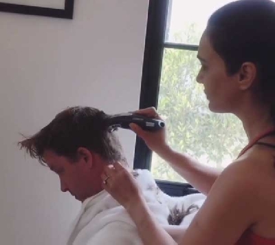 Preity gives 'hubby' Gene a 'good enough' haircut.