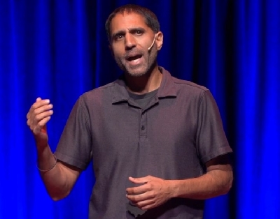A still from a cellphone video made by Paramjit Parmar showing a policeman in Aurora, Colorado, confronting him with a gun on his own property.
