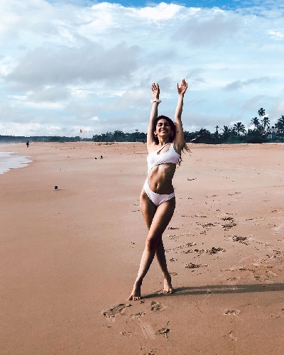 Alaya F celebrates 'freedom' in a white cut-out monokini.