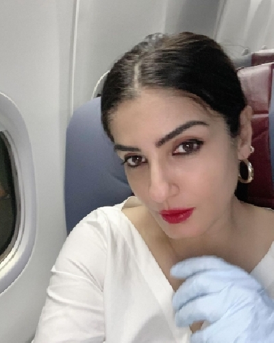 Actress Raveena Tandon has shared a picture doing her final checks before jetting off. The picture is among a string of images she has posted on Instagram that capture her various moods from fixing earrings to taking mirror selfies.