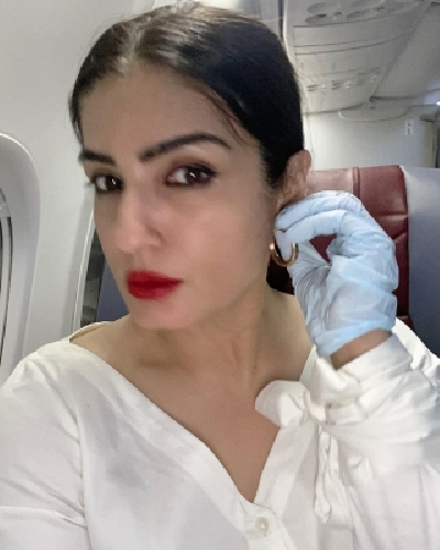 Actress Raveena Tandon has shared a picture doing her final checks before jetting off. The picture is among a string of images she has posted on Instagram that capture her various moods from fixing earrings to taking mirror selfies.