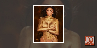 Kylie Jenner shimmers in gold dust body paint photo