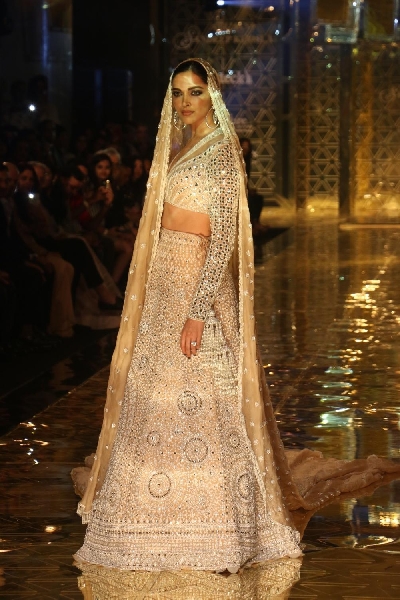 Mumbai: Actress Deepika Padukone showcases a creation of fashion designer Abu Jani-Sandeep Khosla during a fashion show in Mumbai, on Sep 5, 2019. (Photo: IANS)