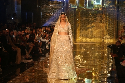 Mumbai: Actress Deepika Padukone showcases a creation of fashion designer Abu Jani-Sandeep Khosla during a fashion show in Mumbai, on Sep 5, 2019. (Photo: IANS)