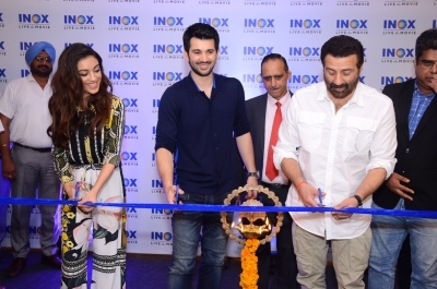 Jalandhar: Actors Sunny Deol, Karan Deol and Sahher Bambba at the launch of a cinema hall in Jalandhar on Sep 14, 2019. (Photo: IANS)