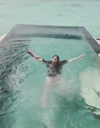 Rapper Badshah has shared a hilarious video of him waking up to the tunes of "Paagal". The rapper took to Instagram on Monday, where he is seen getting woken up by his alarm and then all of a sudden straight jumping out of the window into the infinity pool to get rid of sleepiness.