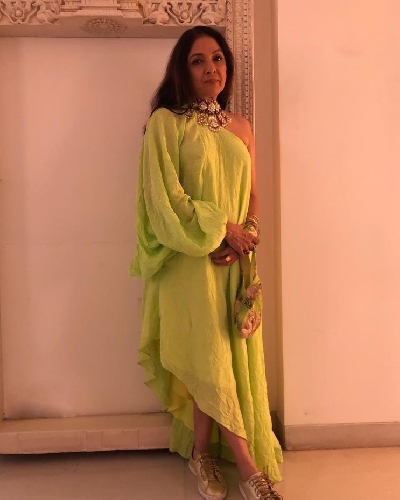 Veteran actress Neena Gupta ditched heels and flowing gown for a gala. Instead, she picked a neon cold shoulder outfit with a pair of sneakers, and won hearts of netizens.