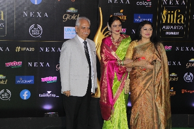 Mumbai: Actress Rekha with filmmaker Ramesh Sippy and his wife Kiran Juneja at the Green Carpet of 20th IIFA Awards, in Mumbai on Sep 18, 2019. (Photo: IANS)