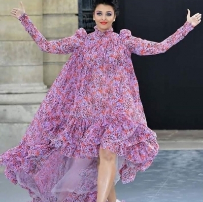 Actress Aishwarya Rai Bachchan recently walked the runway at the ongoing Paris Fashion Week, but her look has received mixed reactions on social media. She wore a pink asymmetrical floral dress by Giambattista Valli, teaming it with fringed footwear, a messy top bun and glittery makeup.